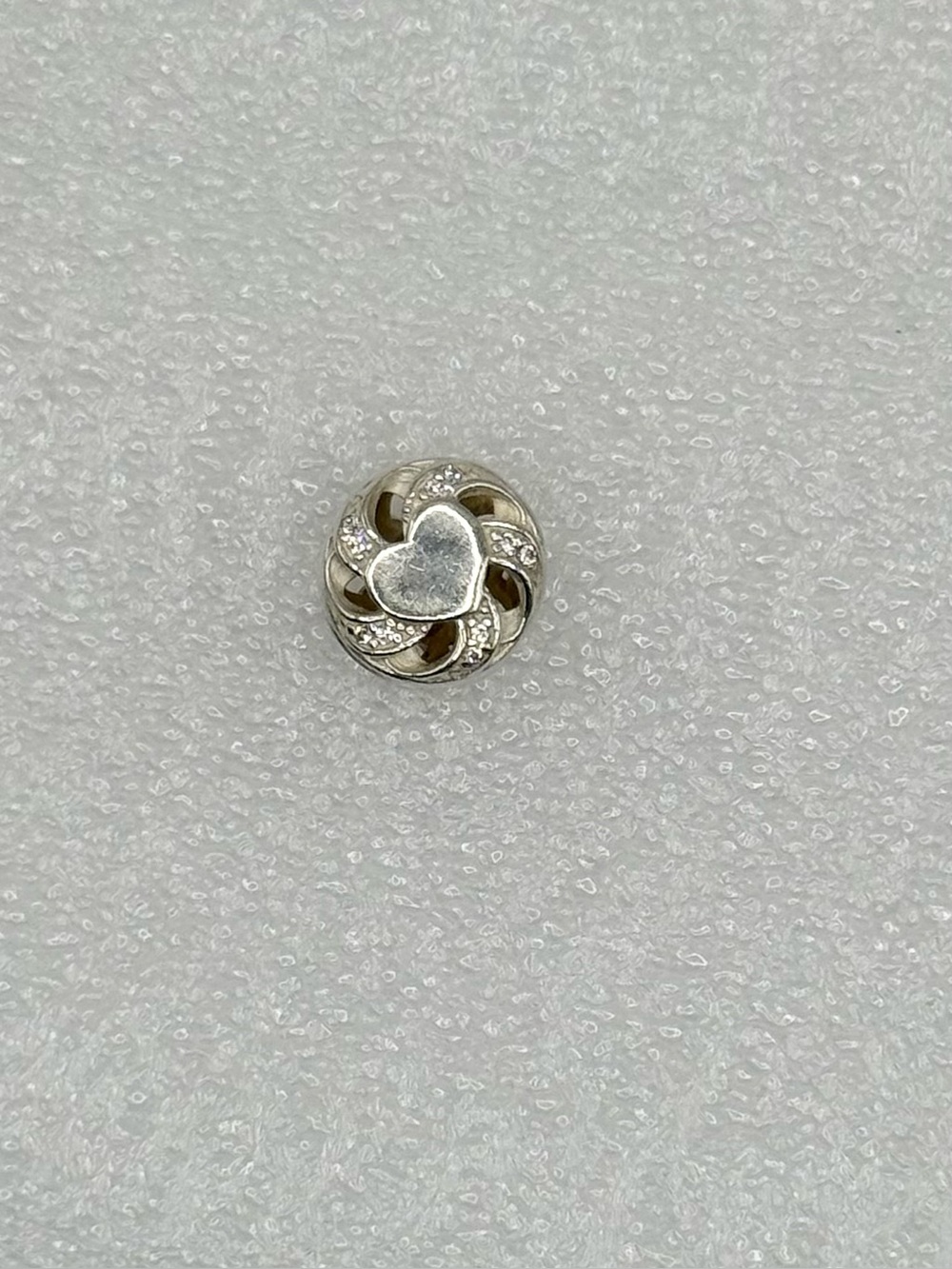 Retired Pandora sterling silver "Ribbon Heart" charm, model 791976CZ preowned